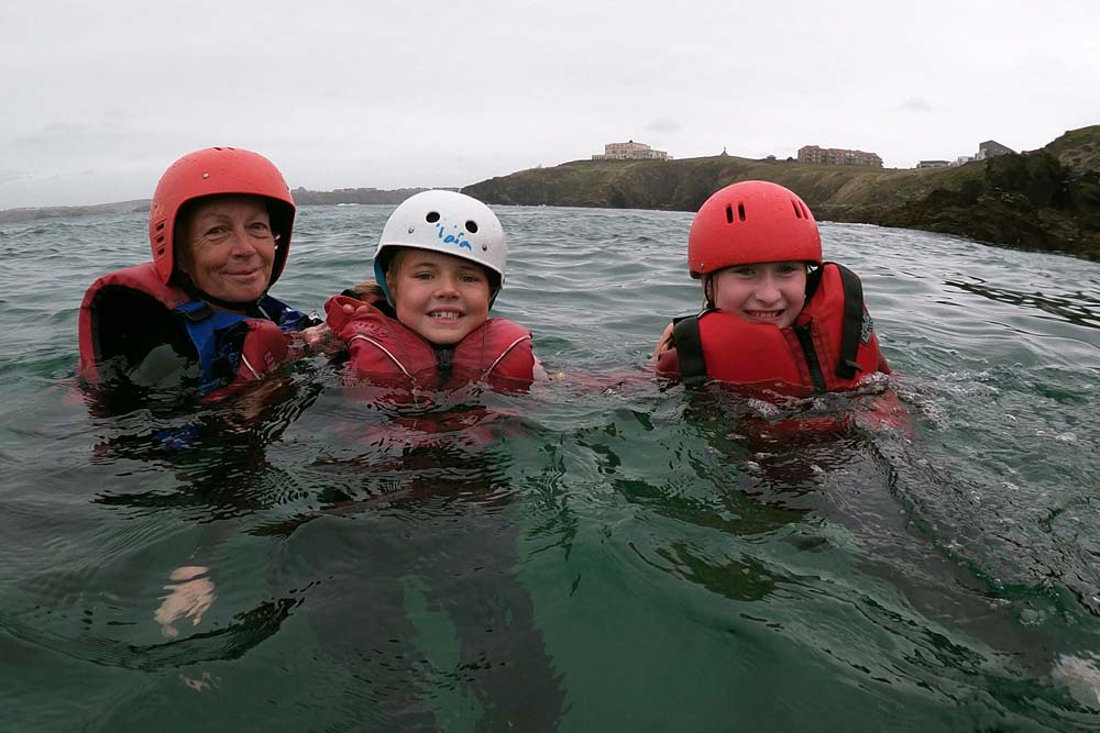 Clore Duffield Coasteering Two students in the water with their teacher